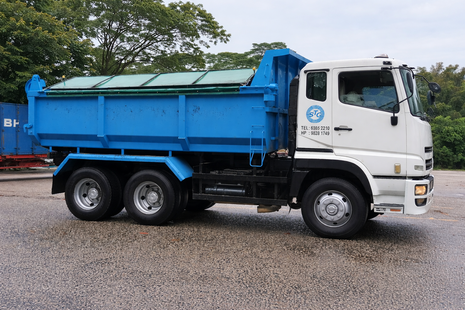 Blue Dump Truck In Industrial Area